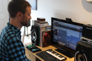 Tom Hunt working in home studio, St Albans