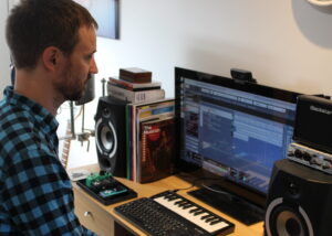 Tom Hunt working in home studio, St Albans